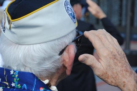 Military veteran saluting the flag