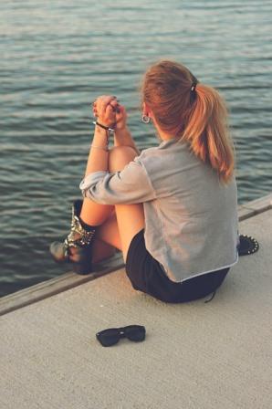 Woman sitting on a dock