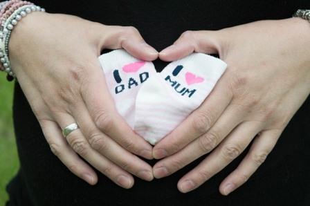 Pregnancy Patient making heart shape with hands