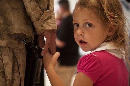 Foster child holding hand of her guardian