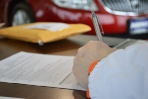 Man filling out paper work for international eating disorder treatment