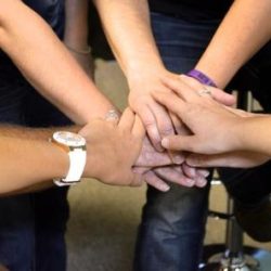 Treatment team with hands together