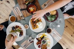 Family working on a meal plan at breakfast