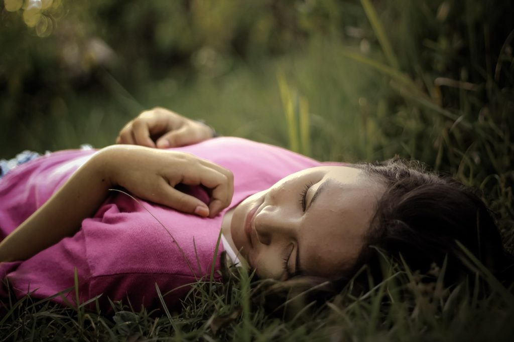 College girl in grass