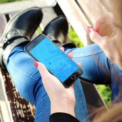 Woman researching Intervention Models on her phone