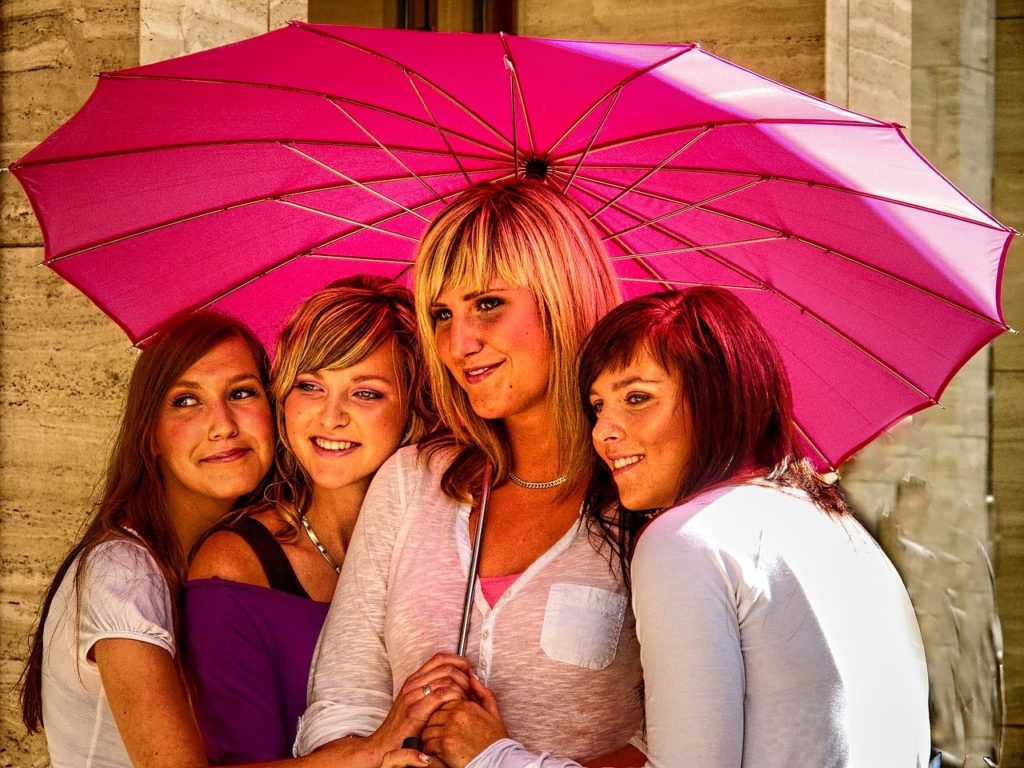 Women under an umbrella discussing Eating disorders in middle-aged women