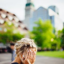 Lady sitting on bench dealing with microaggressions
