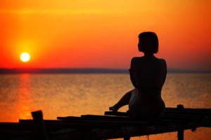 Woman watching the sunrise