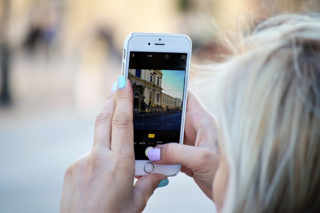 Woman looking at Instagram on her phone