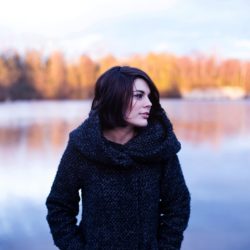 Woman Walking Along The Lake
