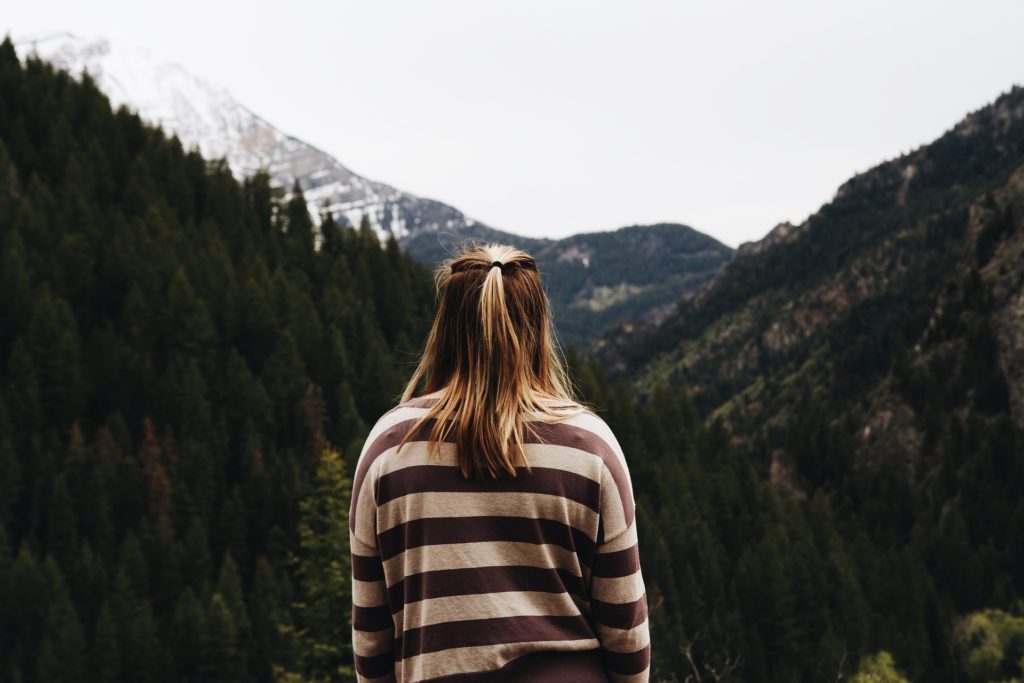 Woman thinking in the mountains