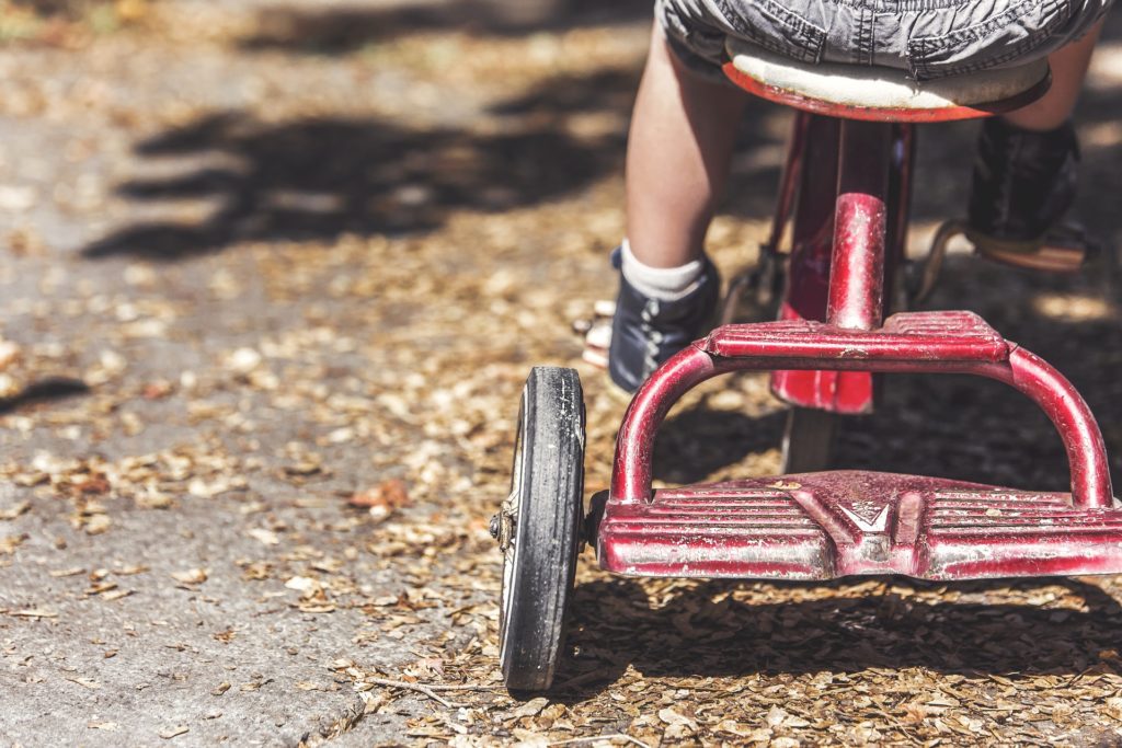 Child on tricycle