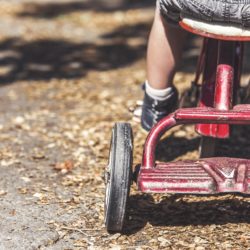 Child on tricycle
