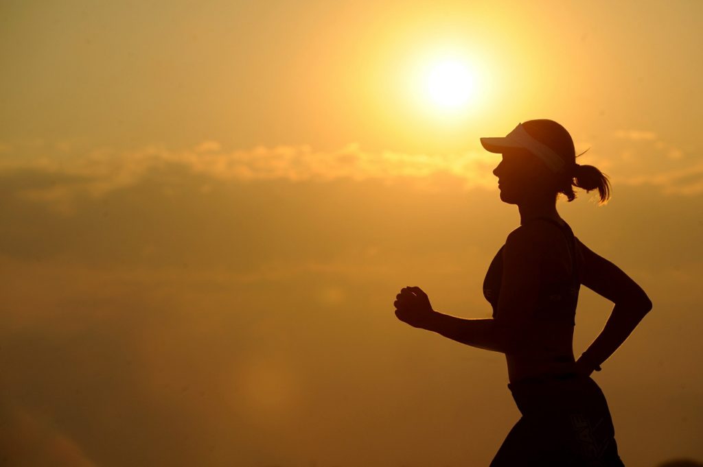 Woman running with Compulsive Exercise and Eating Disorders