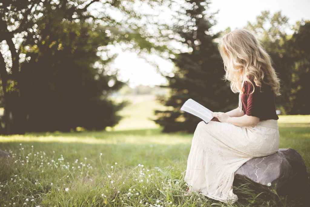 Woman sitting in grass