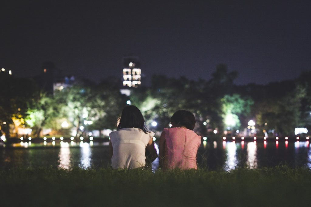 Mother daughter looking at the water