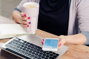 Woman using social media on her phone