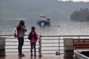 Mother and daughter looking at the river