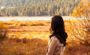 Woman Looking At A Lake and working through Early Life Stress events