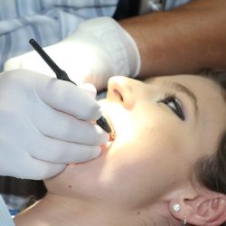 Woman Receiving A Dental Cleaning