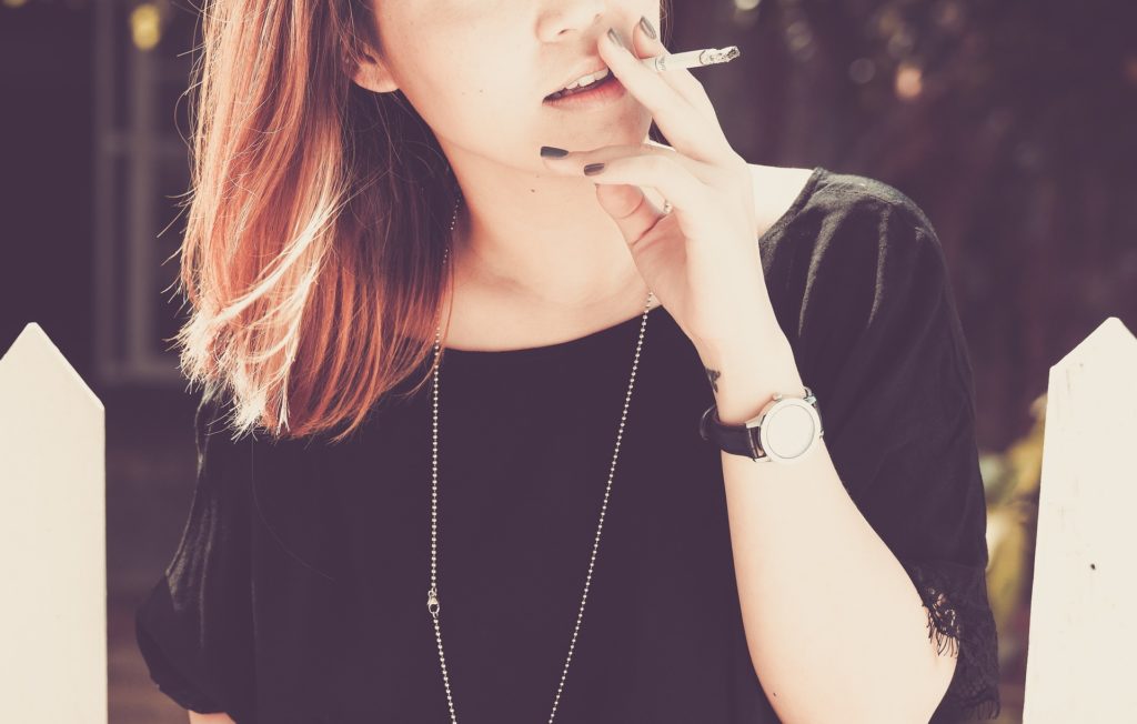 Woman using smoking as appetite suppressant