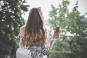 Woman enjoying coffee and college
