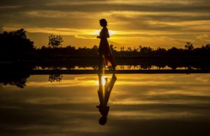 Woman on the beach struggling with co-occurring disorders