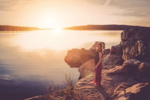 Woman standing on shore worrying about anorexia nervosa