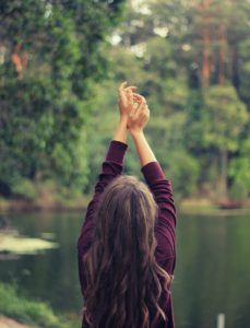 Woman with arms up