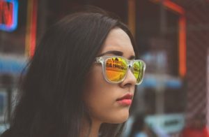 Woman In Mirror Sunglasses struggling with atypical anorexia