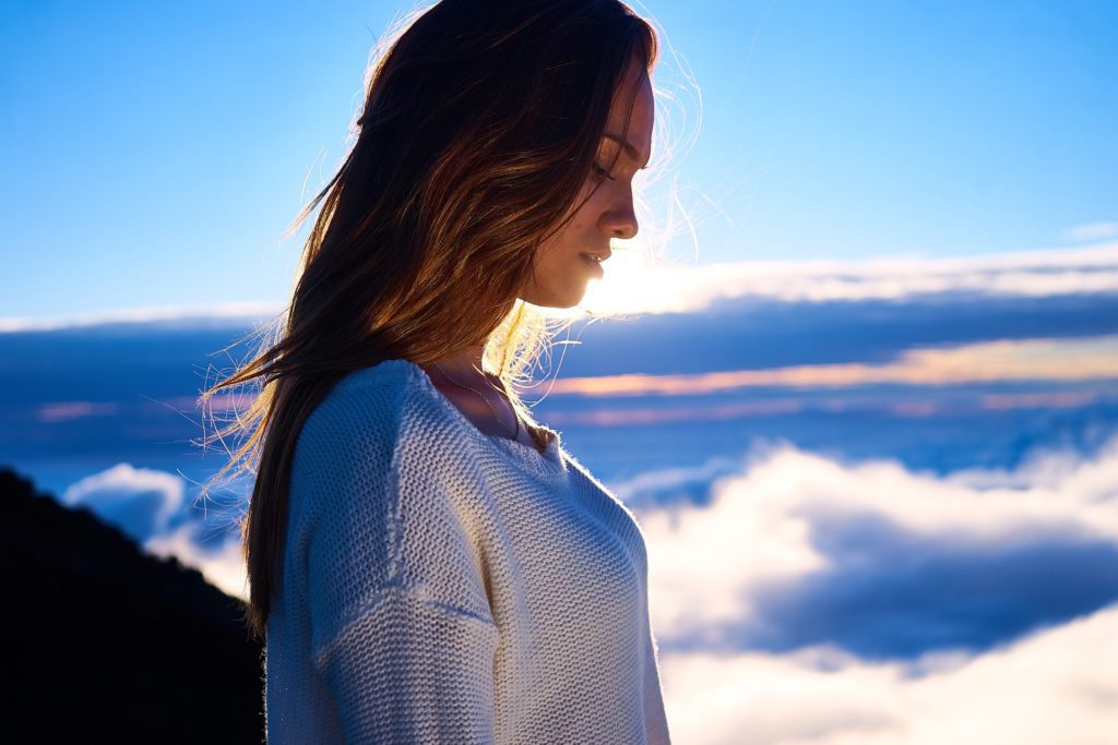 Woman in the sunrise recovering after treatment