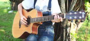 College student playing guitar