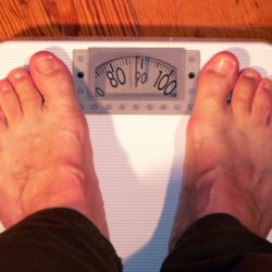 Man weighing in on the scales