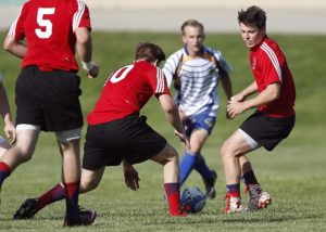 Male teenagers playing ruby