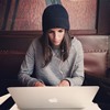 Woman viewing a webinar on her computer