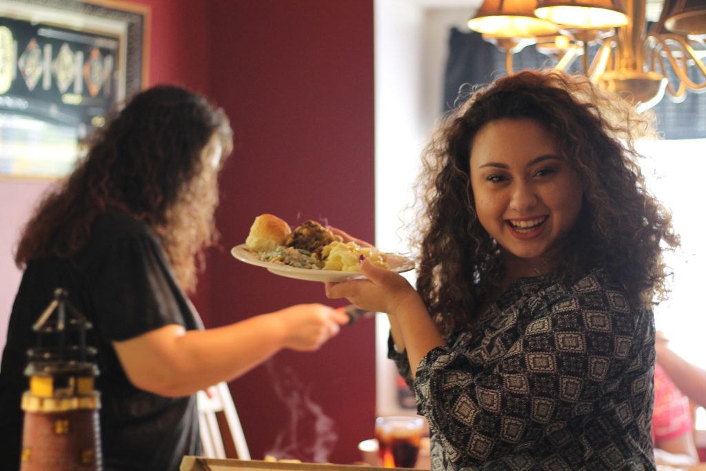 Woman eating food fighting Orthorexia