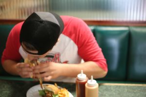 Man eating hamburger