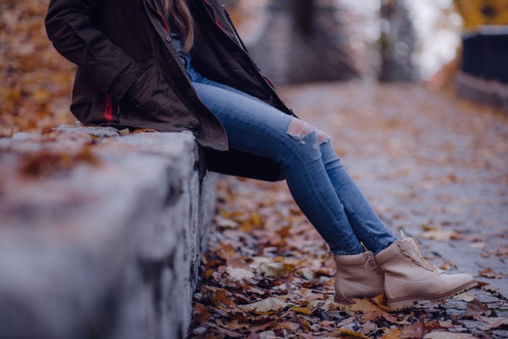 Woman in fall leaves