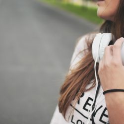 Adolescent girl listening to headphones