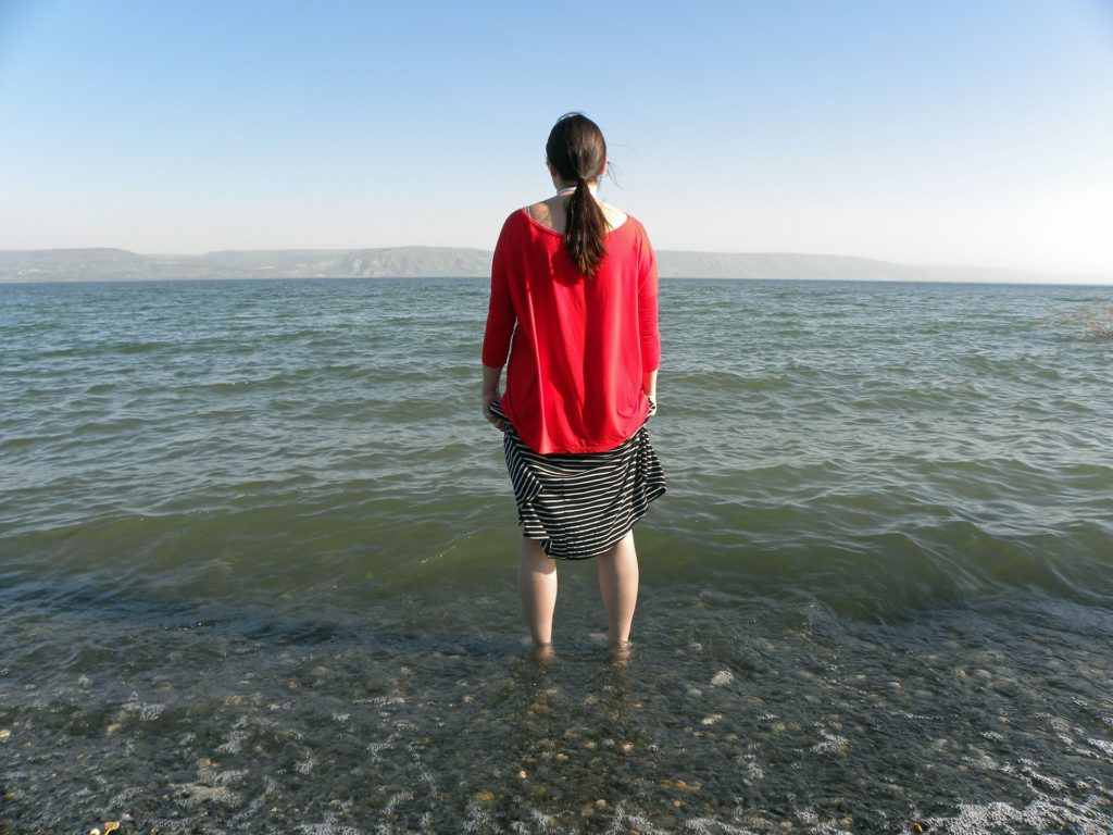 Woman standing near water