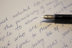 Woman writing "the letter"