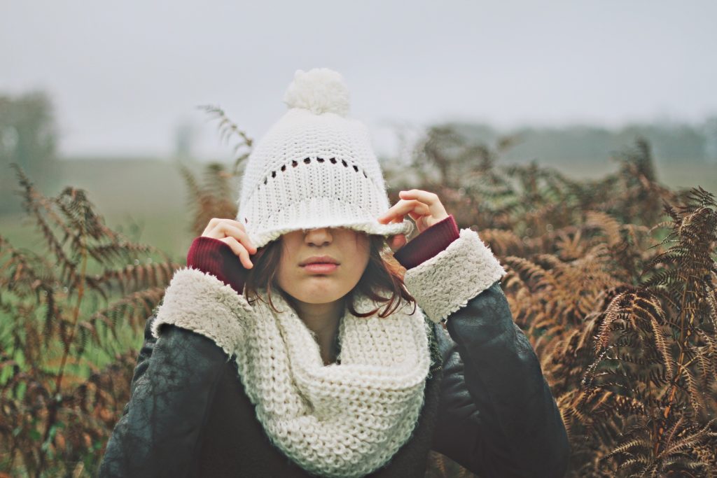 Woman in hat working the eating disorder recovery process