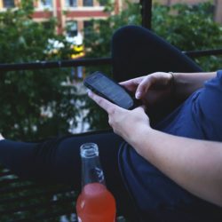 Woman using her phone to check Instagram