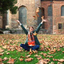 Girl tossing leaves in the air celebrating Recovery from an Eating Disorder