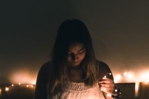 Woman sad and holding lights