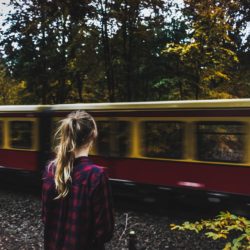 Woman standing by the train