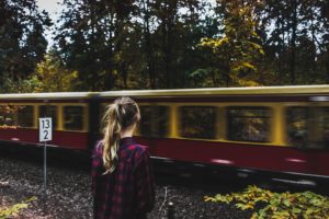 Woman standing by the train