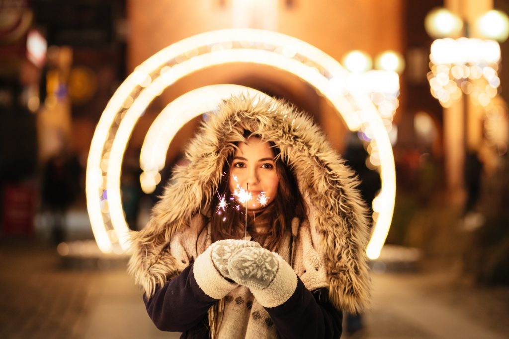 Woman holding holiday lights