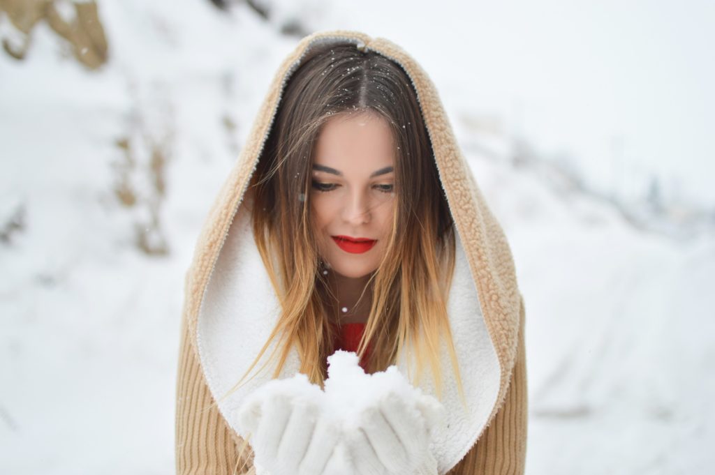 Woman holding snow