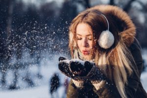 Woman with ear muffs
